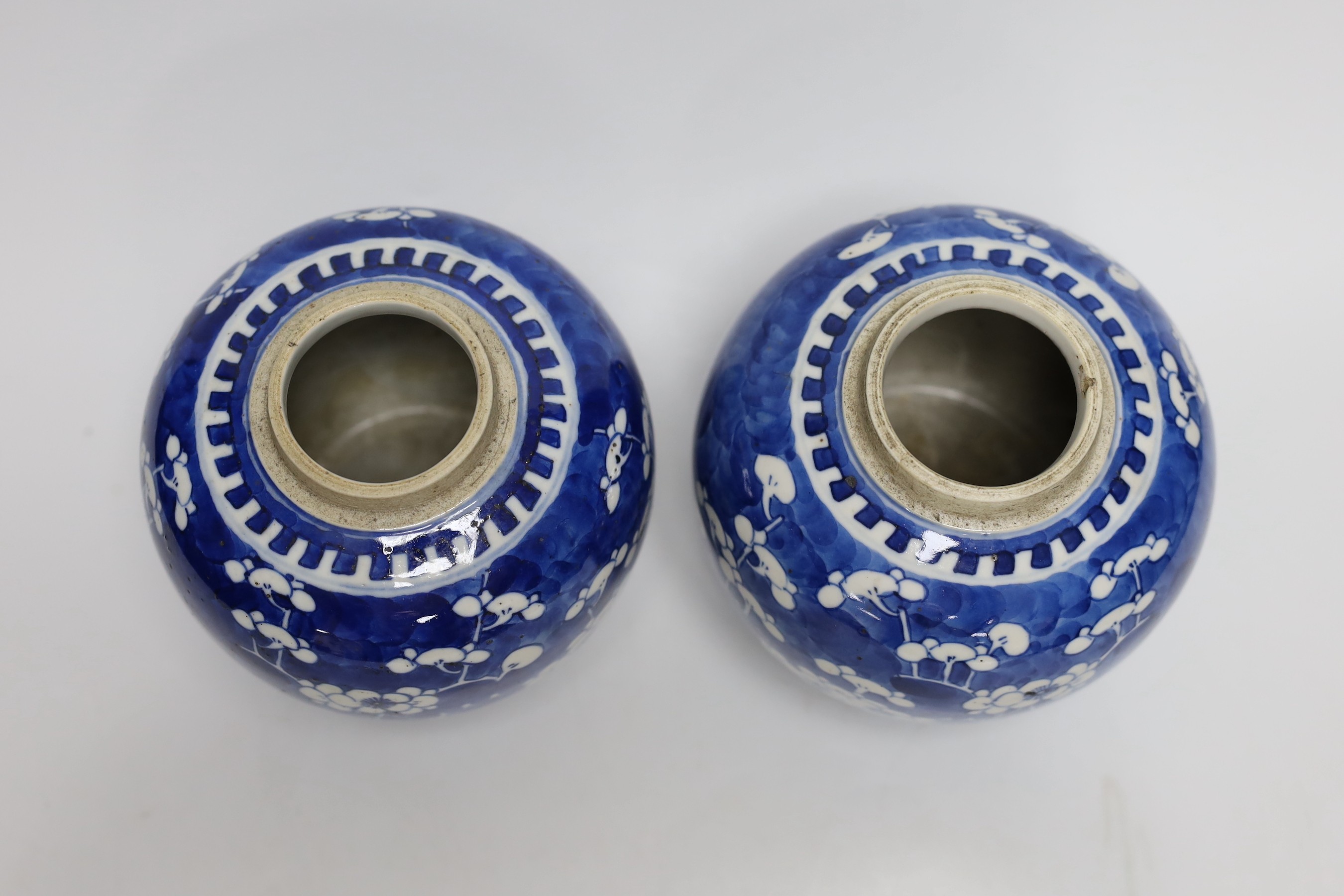 A pair of 19th centiury Chinese blue and white prunus jars, 13.5cms high